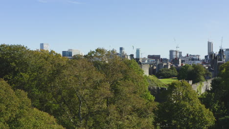 Drone-Shot-Rising-Above-Trees-Revealing-Cardiff-Castle-01