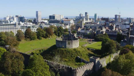 Drone-Shot-Rising-Above-Trees-Revealing-Cardiff-Castle-02