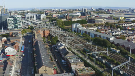 Drone-Shot-Orbiting-Train-Passing-Through-Central-Cardiff-