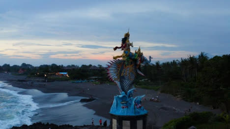 Drone-Shot-Orbiting-Around-the-Gajah-Mina-Statue-