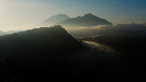 Drone-Shot-Looking-Up-at-Mount-Batur-In-Distance