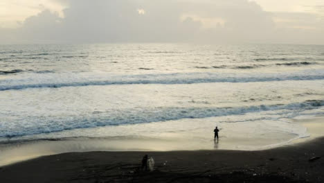 Drone-Shot-Orbiting-People-On-Pigstone-Beach