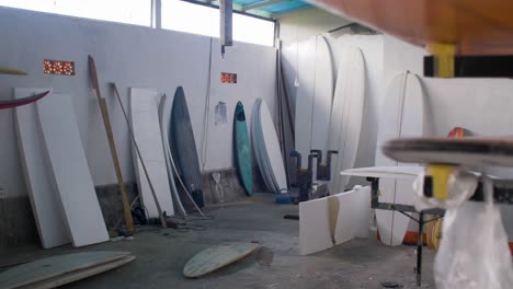 Handheld-Pedestal-Shot-of-Surfboard-Workshop