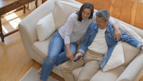 High-Angle-Shot-of-Middle-Aged-Couple-Sitting-On-Sofa-
