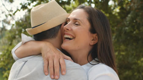 Close-Up-Shot-of-Middle-Aged-Friends-Hugging-and-Embracing