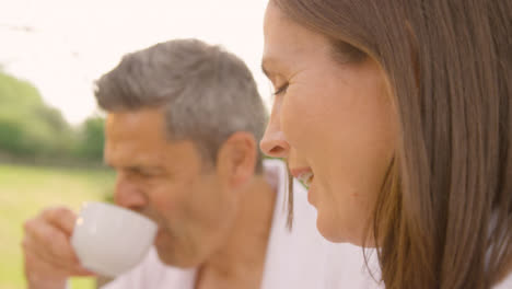 Pull-Focus-Shot-from-Middle-Aged-Man-to-His-Wife-as-They-Drink-Coffee