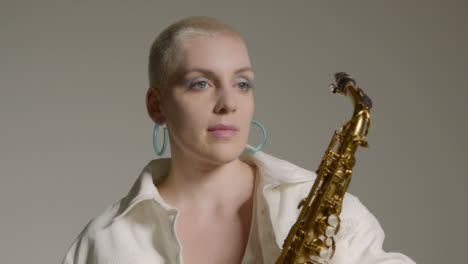 Portrait-Shot-of-Female-Model-Posing-with-Saxophone