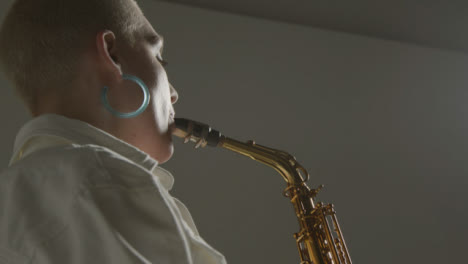 Low-Angle-Shot-of-Model-Playing-Alto-Saxophone