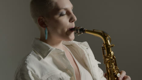 Close-Up-Shot-Orbiting-Around-Model-Playing-Saxophone