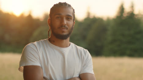 Tracking-Portrait-Shot-Orbiting-Young-Man-at-Sunset