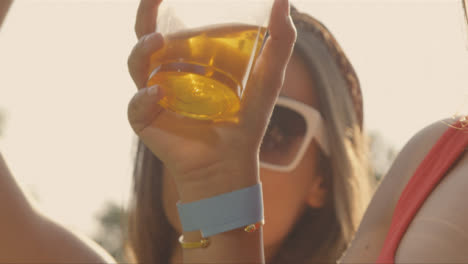 Close-Up-Shot-of-Young-Festival-Goer-at-Stage-Barrier-Enjoying-Music