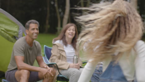 Tracking-Shot-Following-Children-Running-to-Their-Family-On-Camping-Trip