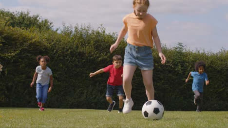 Tracking-Shot-of-Group-of-Children-Playing-Football-04