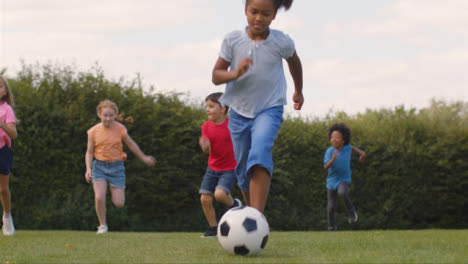 Tracking-Shot-of-Group-of-Children-Playing-Football-05