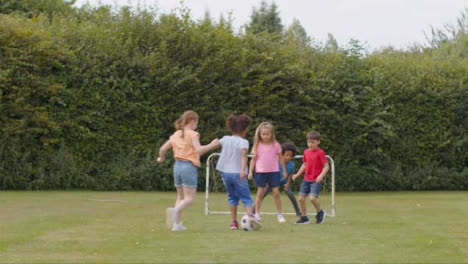Tracking-Shot-of-Group-of-Children-Playing-Football-09