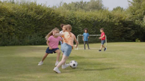 Tracking-Shot-of-Group-of-Children-Playing-Football-11