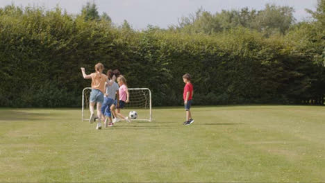 Tracking-Shot-of-Group-of-Children-Playing-Football-12