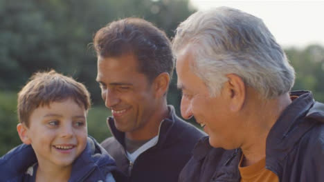 Close-Up-Shot-of-Grandfather,-Father-and-Son-Talking-02