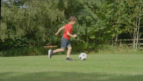 Handheld-Shot-of-Children-Playing-Football