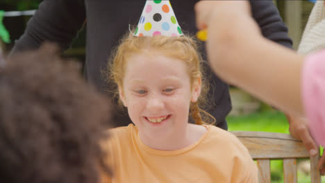 Over-the-Shoulder-Shot-of-Child-Birthday-Party-Guest-Smiling