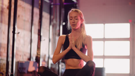Slow-Motion-Of-Attractive-Female-Athlete-Practicing-Yoga-At-Health-Club