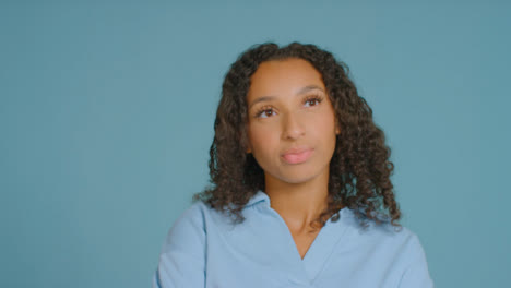 Portrait-Shot-of-Young-Adult-Woman-Visibly-Thinking-to-Herself