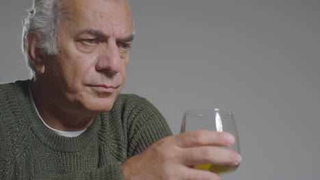 Close-Up-Shot-of-Senior-Man-Drinking-Alcohol-