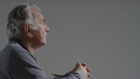 Side-Profile-Shot-of-Senior-Man-Praying