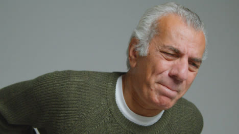 Close-Up-Shot-of-a-Senior-Man-Experiencing-Severe-Back-Pain