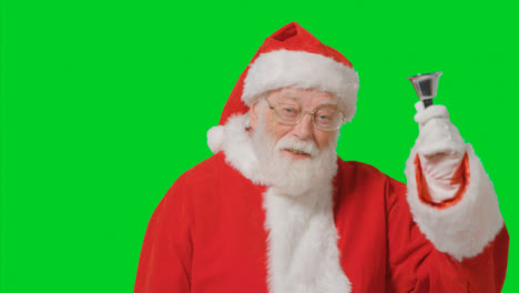 Porträtaufnahme-Des-Weihnachtsmannes,-Der-Vor-Grünem-Bildschirm-Klingelt