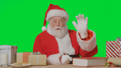 Portrait-Shot-of-Santa-Talking-to-Camera-In-Front-of-a-Green-Screen-