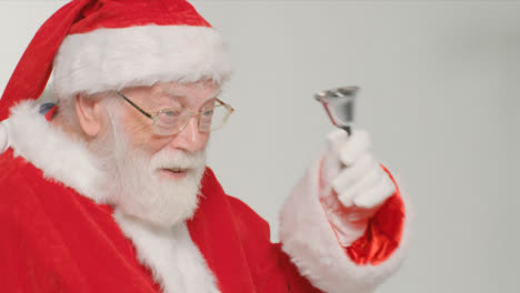 Close-Up-Shot-of-Santa-Ringing-a-Bell