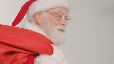 Close-Up-Shot-of-Santa-Holding-Sack-of-Presents