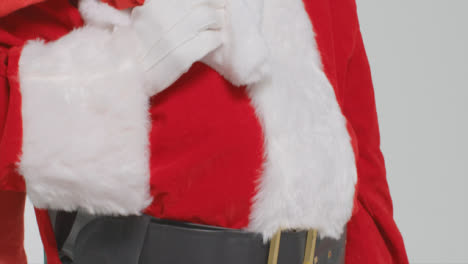 Pedestal-Shot-of-Santa-Holding-Sack-of-Presents