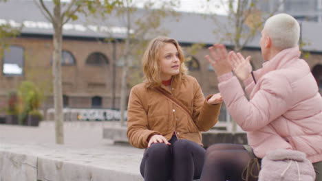 Medium-Shot-of-Two-Young-Women-Arguing-In-Public