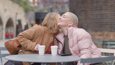 Medium-Shot-of-Young-Woman-Joining-Friend-for-Coffee