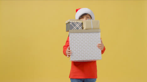 Boy-Peeping-Over-Christmas-Presents