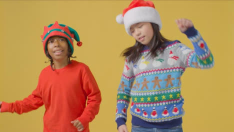 Two-Boys-in-Christmas-Outfits-Dancing-to-Camera