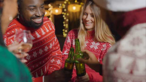 Close-Up-Shot-of-a-Group-of-Friends-Celebrating-Christmas-at-a-Bar