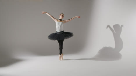 Wide-Shot-of-Ballet-Dancer-Twirling-and-Dancing-on-Pointe