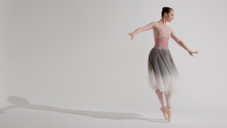 Wide-Shot-of-Ballet-Dancer-Dancing-Through-the-Frame-on-Pointe