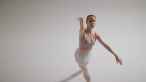 High-Angle-Shot-of-Ballet-Dancer-Dancing-and-Spinning