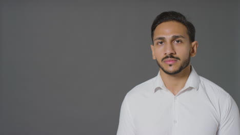 Portrait-Shot-of-a-Young-Man-Smiling-with-Copy-Space