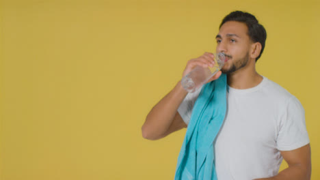 Mid-Shot-of-Young-Man-Drinking-Water-with-Copy-Space