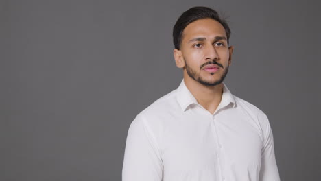 Portrait-Shot-of-Young-Man-with-a-Neutral-Expression