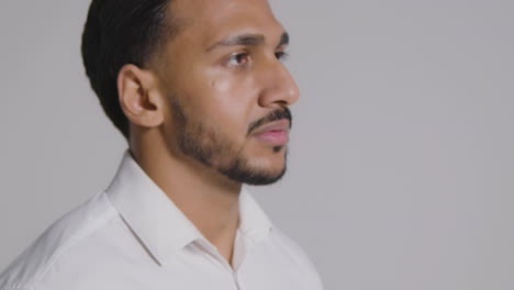 Tracking-Shot-of-Young-Man-with-Neutral-Expression