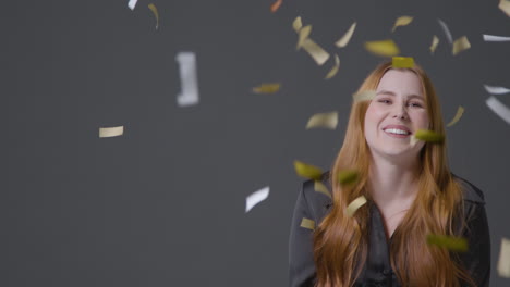 Medium-Shot-of-Young-Woman-Celebrating-with-Confetti