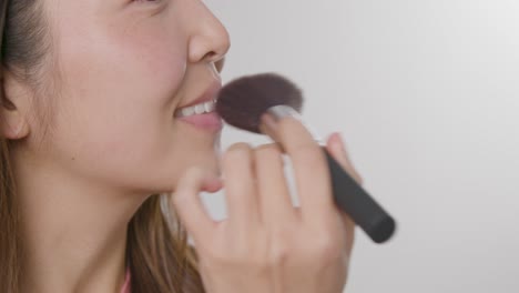 Close-Up-Shot-of-Woman-Applying-Makeup