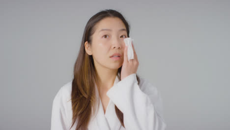 Mid-Shot-of-Woman-Taking-off-Makeup