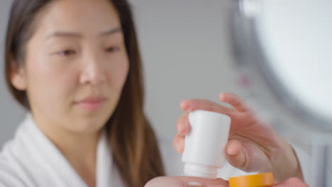Close-Up-Shot-of-a-Woman-Pouring-Pill-into-Her-Hand